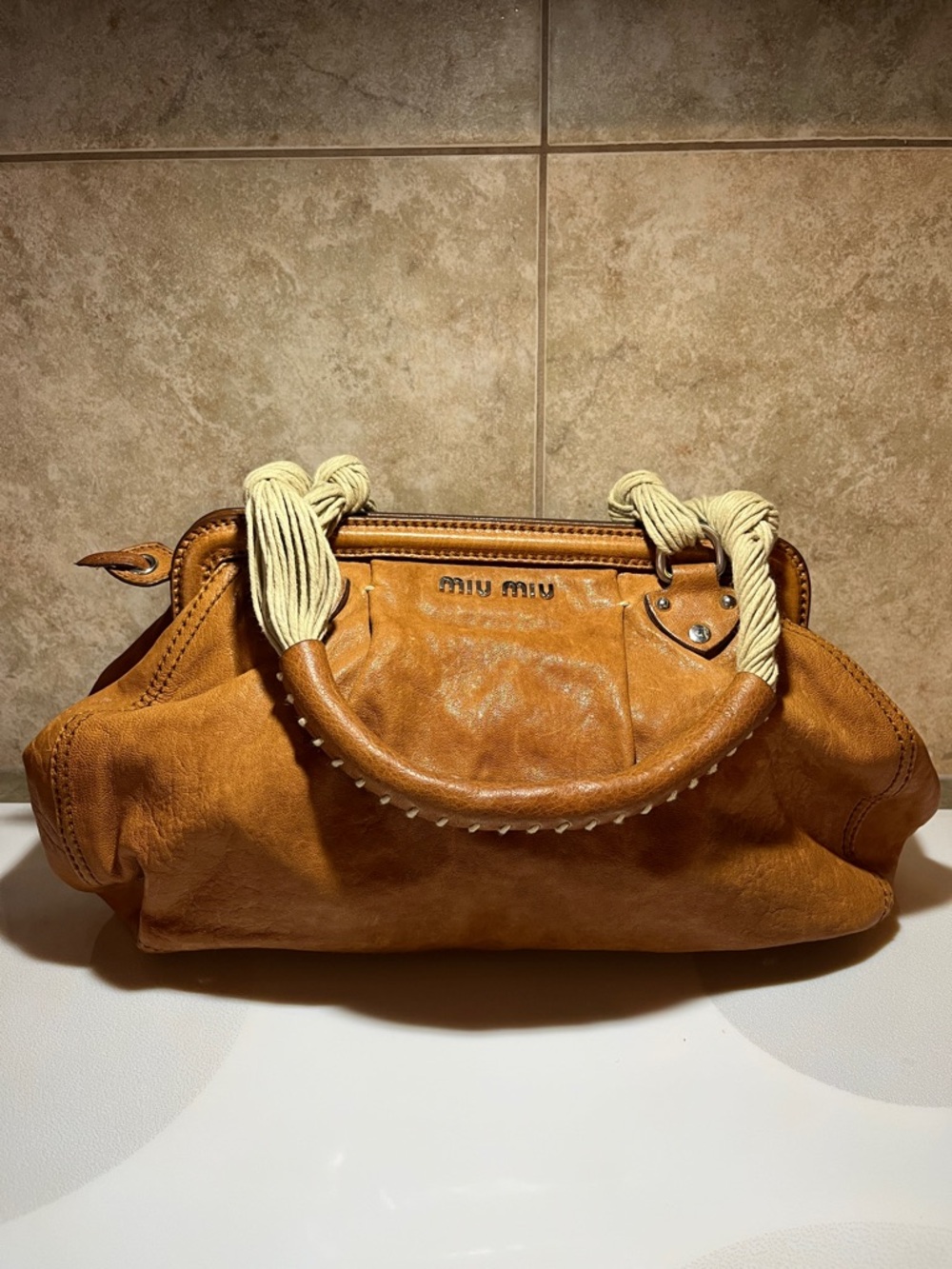 MIU MIU  Authentic  brown leather bag with unique rope handles